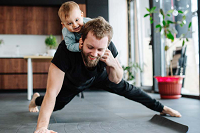 Man doing sport with his baby